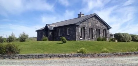 Detached cottage overlooking lake in Connemara